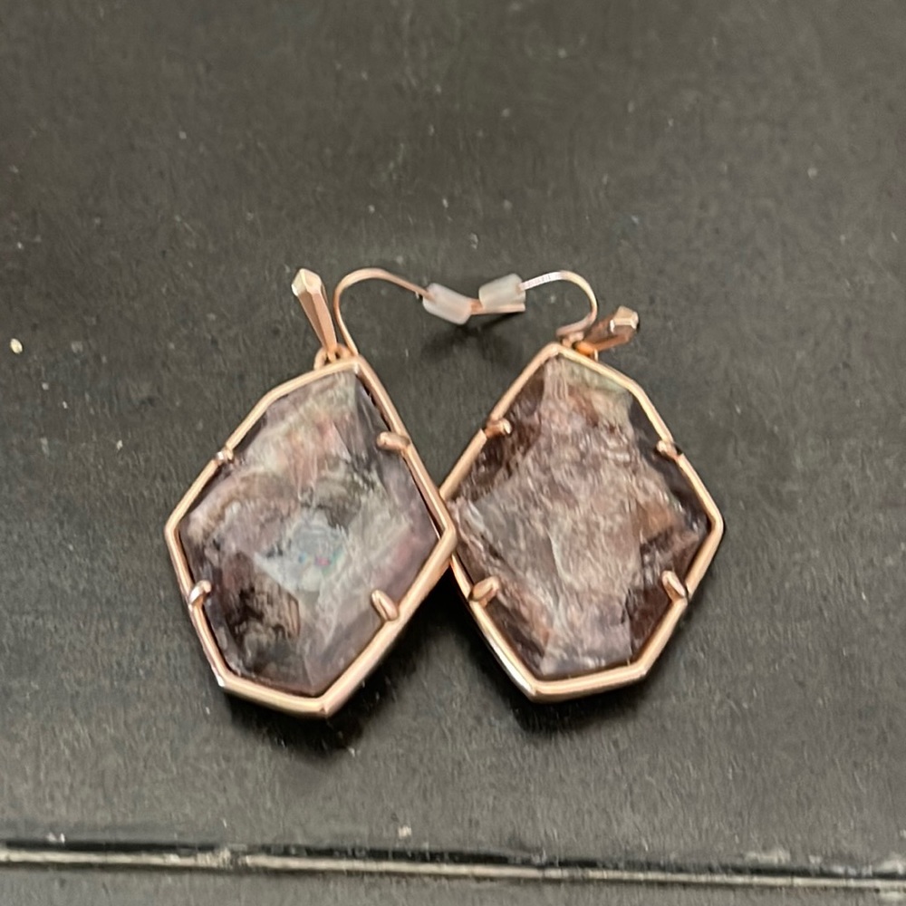 Brown Kendra Scott earrings.